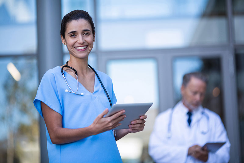 Doctor and nurse using digital tablet